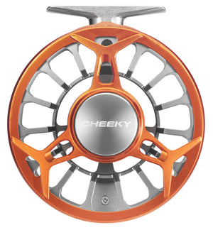 Close-up of an orange and silver Cheeky Spray 400 fly reel showing the frame-side view with machined cutouts.