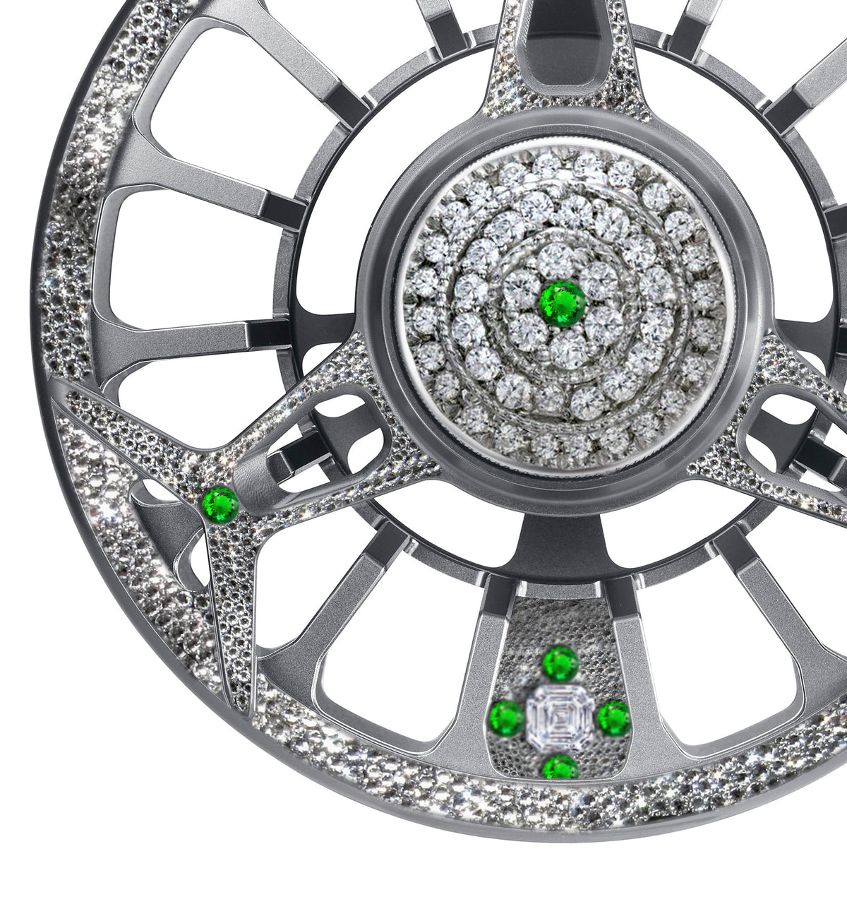 Close-up of the Diamond Drift fly reel featuring silver metalwork encrusted with diamonds and green gemstones.