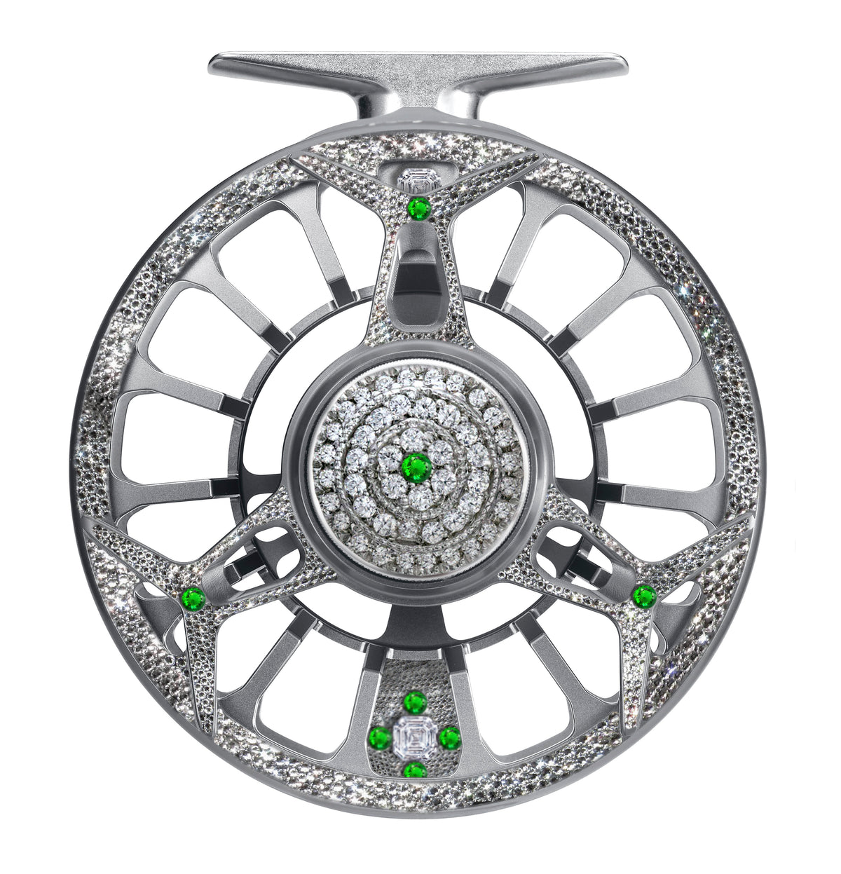 Silver Diamond Drift fly reel embellished with diamonds and green gemstones in a symmetrical, luxury design.