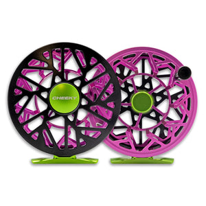 Two Cheeky fly-fishing reels in black, pink, and green with open-frame designs displayed side by side.