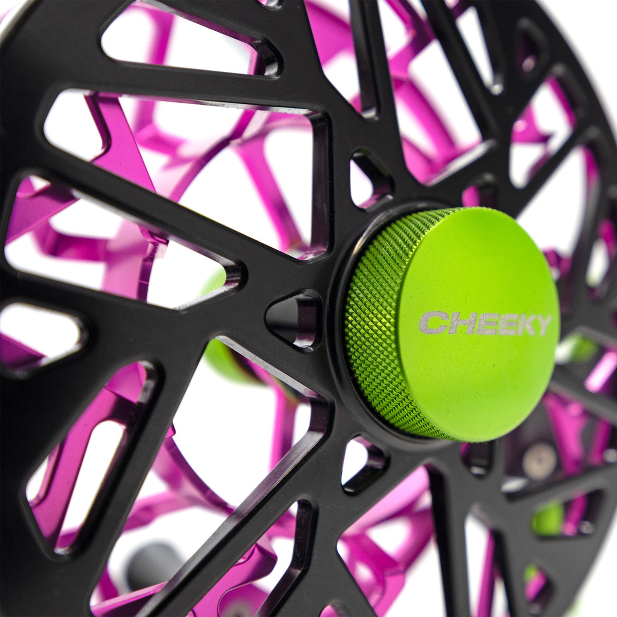 Close up Photo of a black, green, and pink fly fishing reel called the Cheeky Bodacious Burst Fly Reel