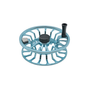 Light blue Cheeky fly fishing reel spool with ventilated design, center knob, and handle, shown on a white background.