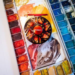 trutta burst 350 reel on a pain pallet showcasing the colors used to design the reel